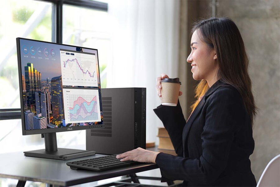 BE27AQG Veri analizi ve grafiklerle finansal veriler üzerinde çalışan kadın bilgisayar kullanıyor, ofis ortamında finans ve ekonomi temalı iş ortamı, yüksek çözünürlük ve modern teknoloji detayları.