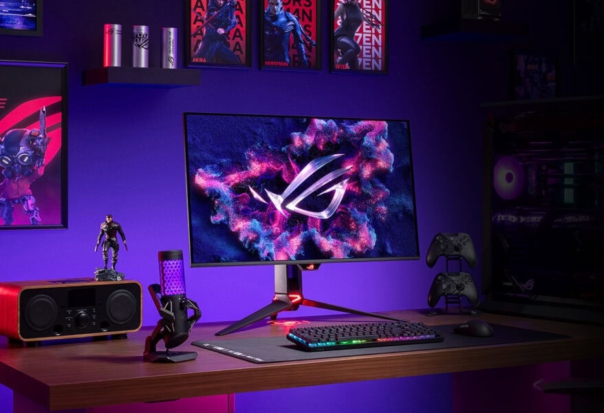 ROG Swift OLED PG32UCDMZ Gaming bilgisayar ve monitör ile donatılmış oyuncu odası, RGB aydınlatma ve oyun aksesuarlarıyla zenginleştirilmiş, yüksek performanslı gaming ekipmanları, kendi oyun alanınızı oluşturmanıza imkan sağlar.