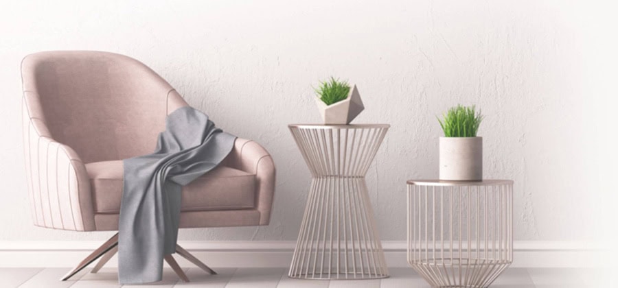 Şık ve modern oturma alanı, rahat koltuk, yan sehpa ve dekoratif bitkilerle tamamlanmış minimalist tasarım.